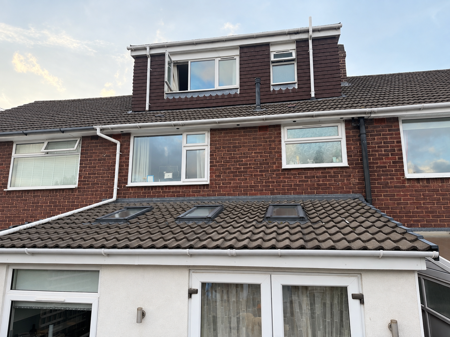 Tiled lean-to extension roof with three Velux windows fitted by WF Roofing in Cannock